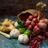 Various spices and herbs for cooking on black background
