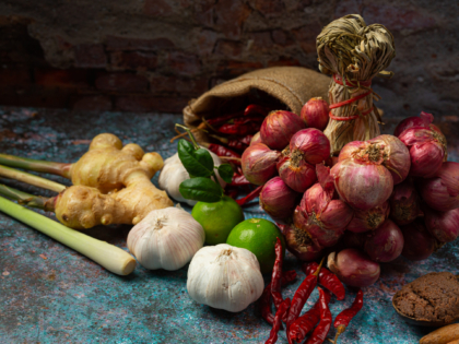 Various spices and herbs for cooking on black background