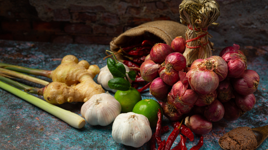 Various spices and herbs for cooking on black background
